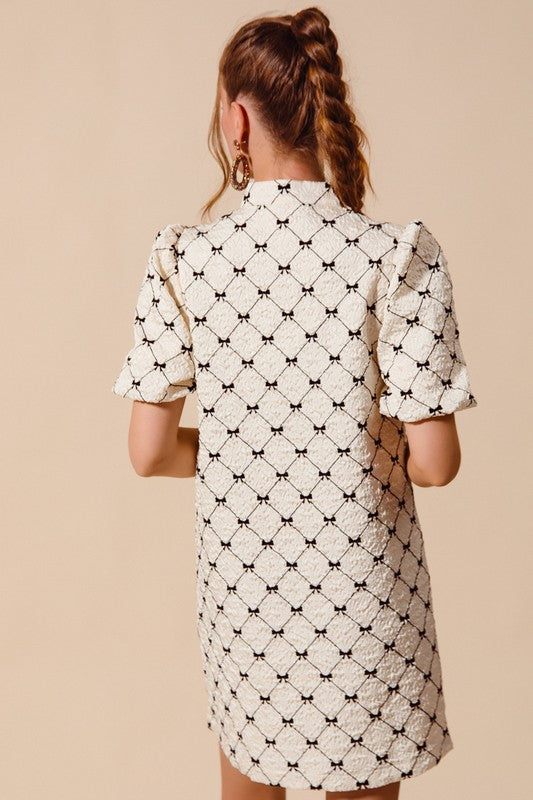 Black and cream bow print dress