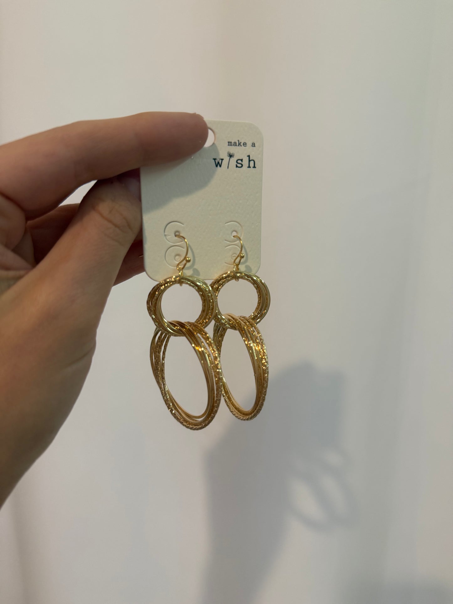 Gold circle drop earrings