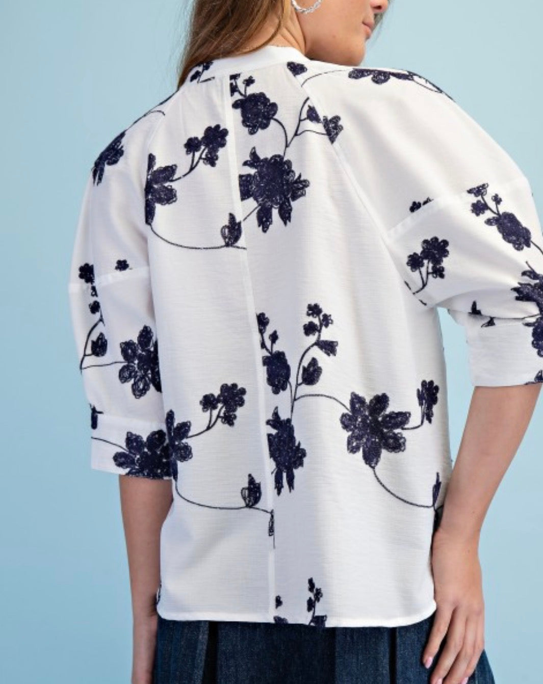 White and navy embroidered top
