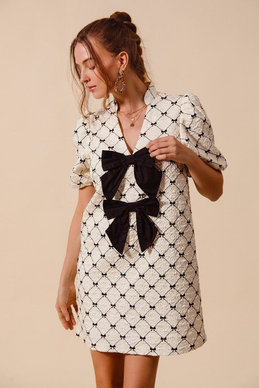 Black and cream bow print dress