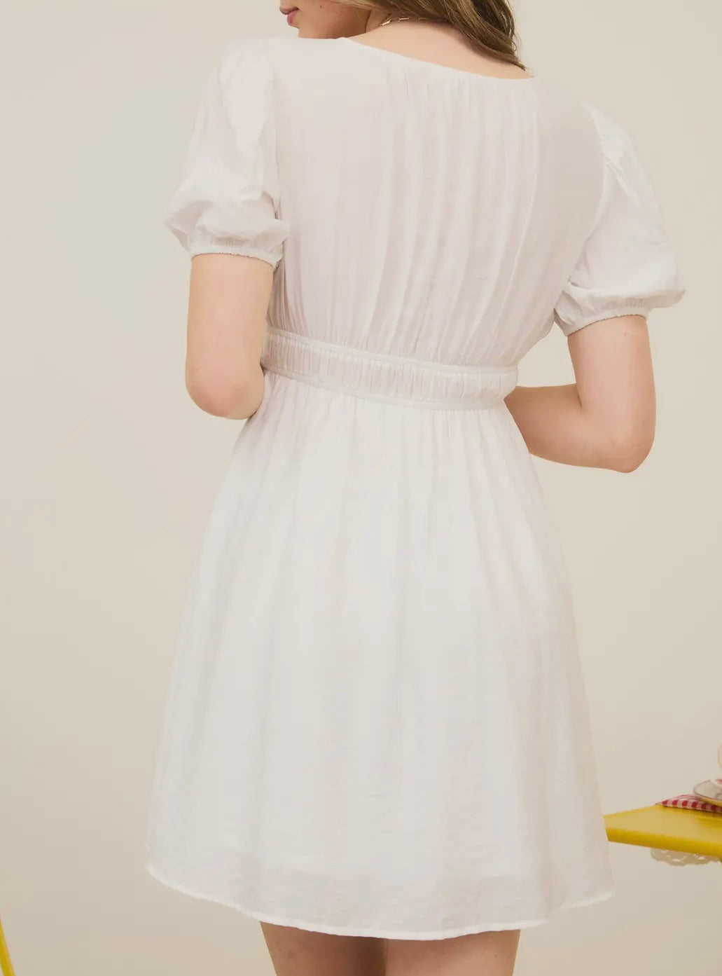 White mini dress with bow detail