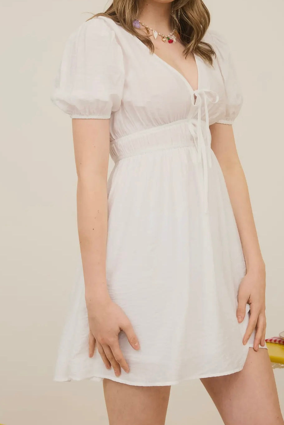 White mini dress with bow detail