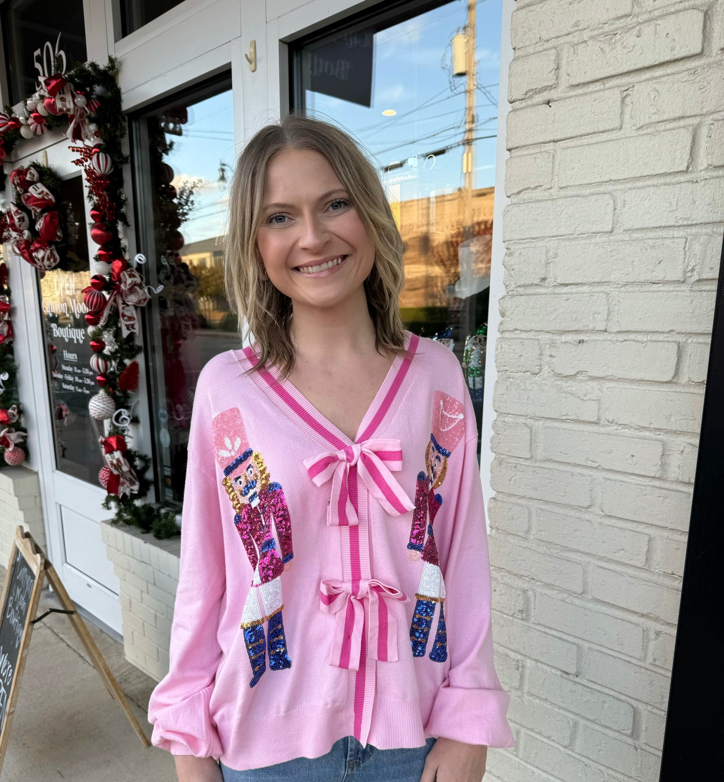 Pink nutcracker bow cardigan