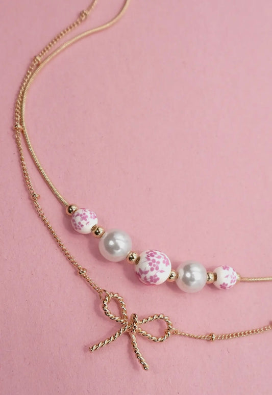 Pink and white layered bow necklace