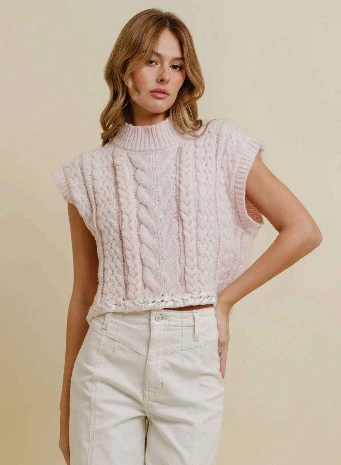 Pink and white sleeveless sweater