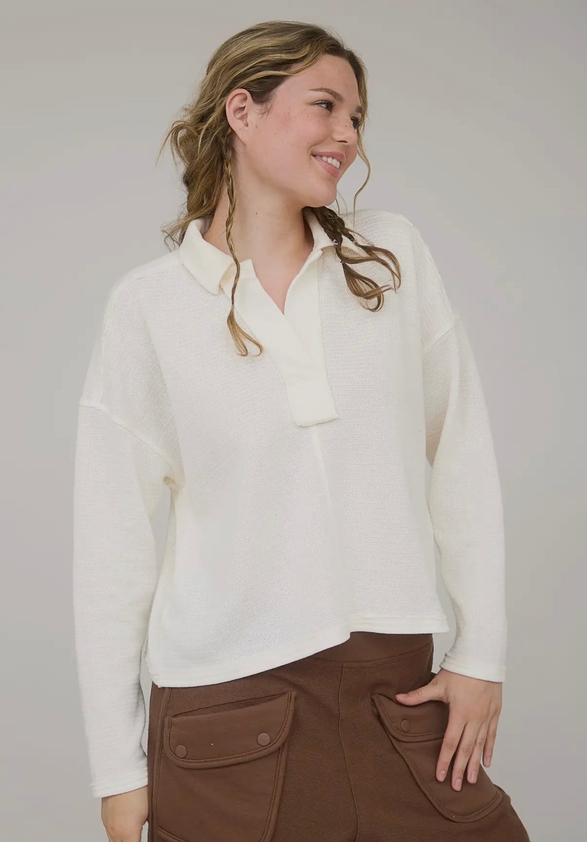 Cream exposed seam top