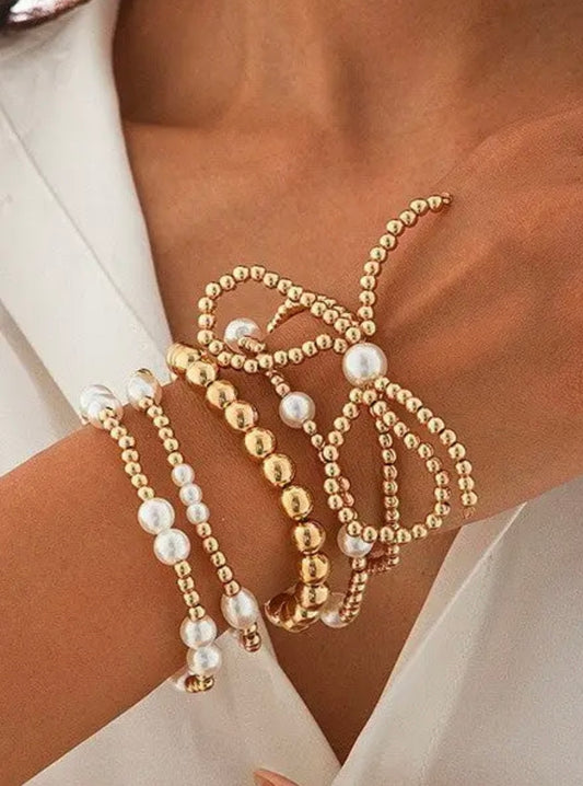 Pearl and gold bow bracelet set