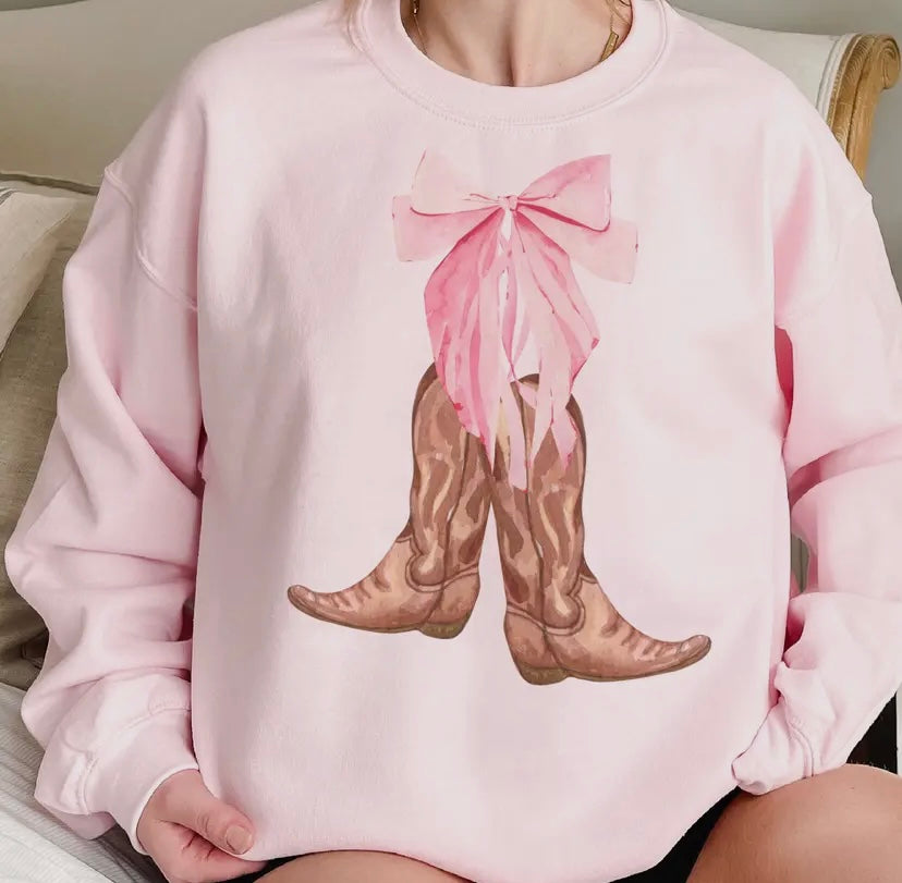 Cowboy boots and bow sweatshirt