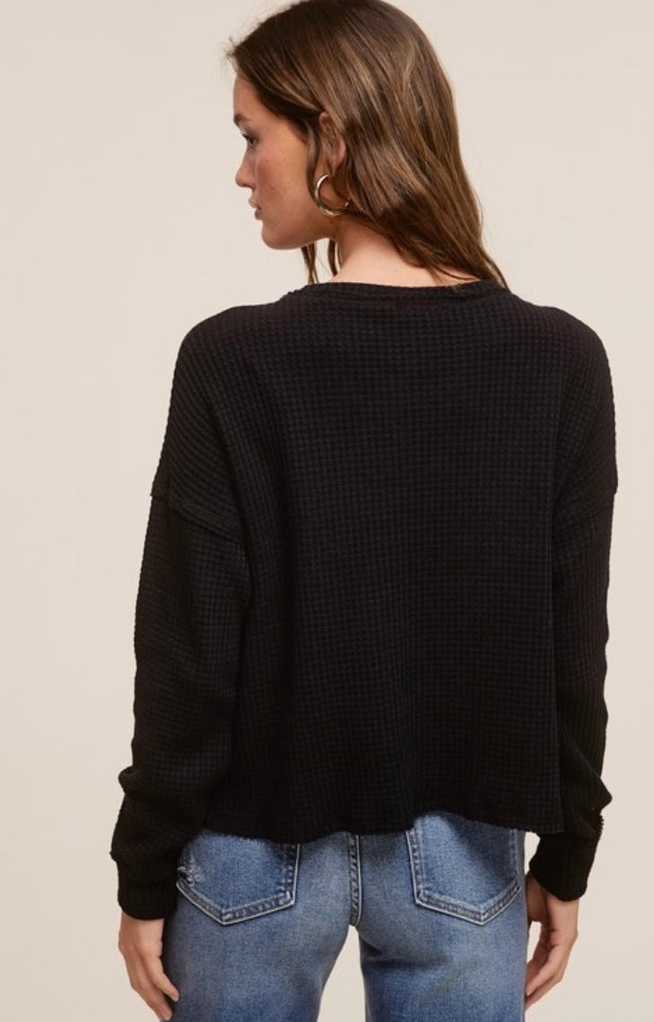 Black waffle knit long sleeve top