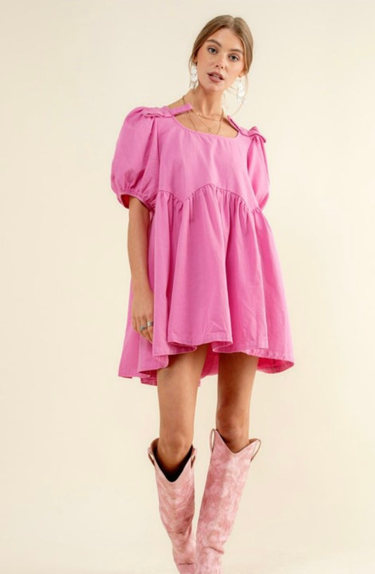 Pink denim dress with bow detail